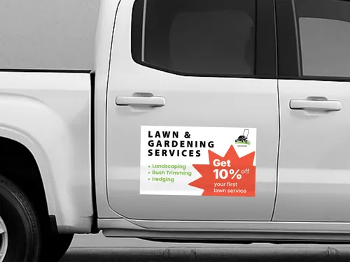 Promotional truck decal for Lawn & Gardening Services applied to the truck’s side door.