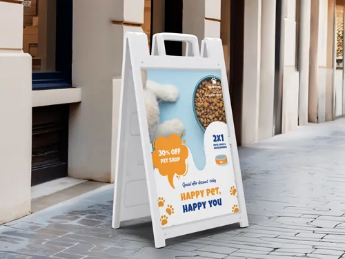 White sandwich board with pet shop promo, showing pet food, and bold discount text.