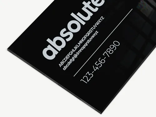 Black acrylic sign with custom lettering and a sleek, modern design. Durable and ideal for both indoor and outdoor use