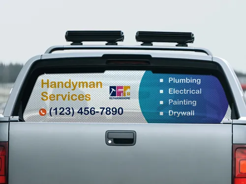 A business promotion perforated truck window decal with the company services and phone number.