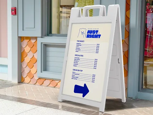 Cafe sandwich board in blue and white displaying a menu list with drinks and food items.