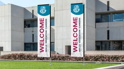 Two educational custom flags displaying a bold welcoming message.