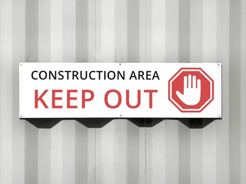Aluminum construction zone warning sign with a red and white stop icon.
