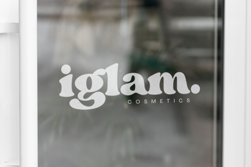 Frosted vinyl lettering on the storefront window for branding purposes. 