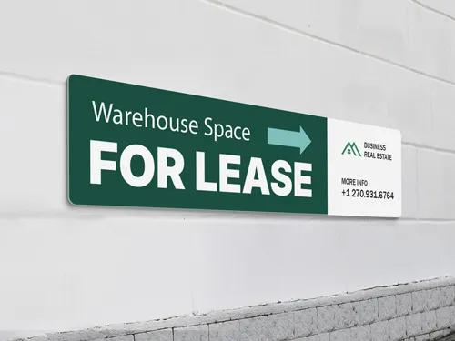 Durable PVC sign with a bold green and white layout, advertising warehouse space for lease with contact info and directional arrow, mounted on an exterior wall