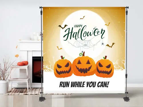 Halloween-themed step and repeat banner reading Run While You Can.