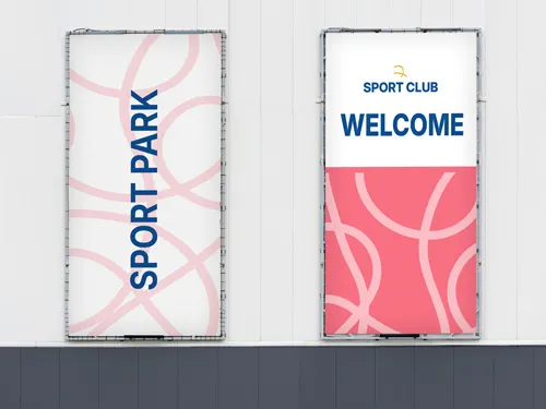 Vertical mesh banners reading Sport Park and Sport Club Welcome on a building wall.