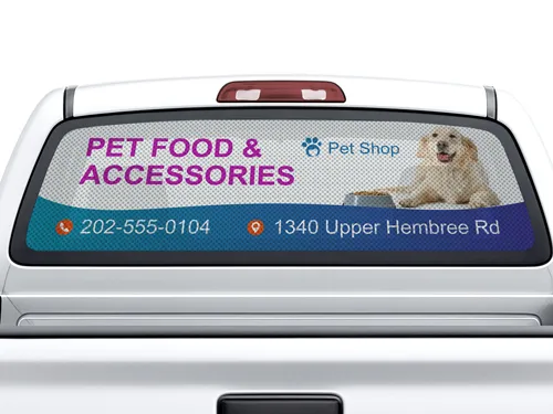 Perforated truck window decal material showcasing a pet shop's services and information.