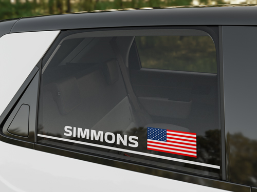 Vinyl lettering showing Simmons and American flag on a car window.