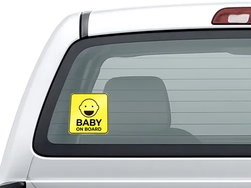 Reflective truck window material with a baby on board message.