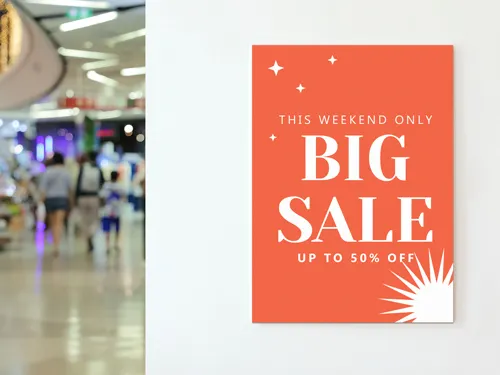 Vibrant styrene sign with bold text and colorful graphics, designed for eye-catching retail promotions and in-store displays
