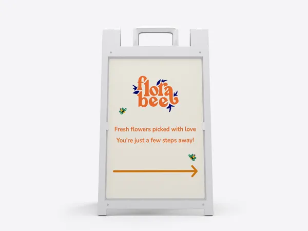 A navigational sandwich board for Flora Bee with flowers, text, and arrow pointing to the right.