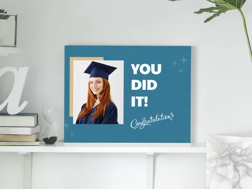 Wooden sign for special occasion showing a graduating girl with the text You Did It.