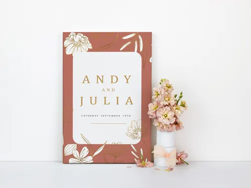 Free-standing wooden wedding sign with Andy and Julia and subtle decor accents.