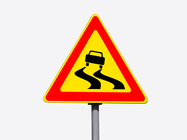 Bold reflective aluminum sign with a bright red background and white warning text, designed for high visibility in safety and hazard zones