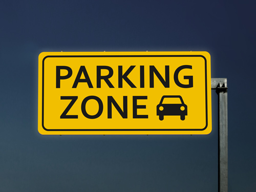 Reflective aluminum sign with a bold yellow background and black parking symbol, designed for high visibility in lots and designated parking areas